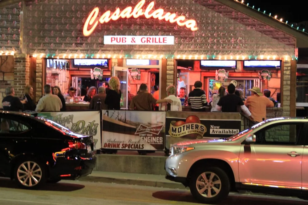 Casablanca Pub & Grill at night with its illuminated sign and open front bar on the Bagnell Dam Strip